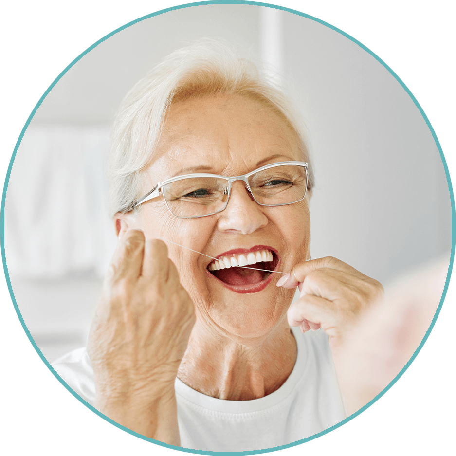 senior woman flossing